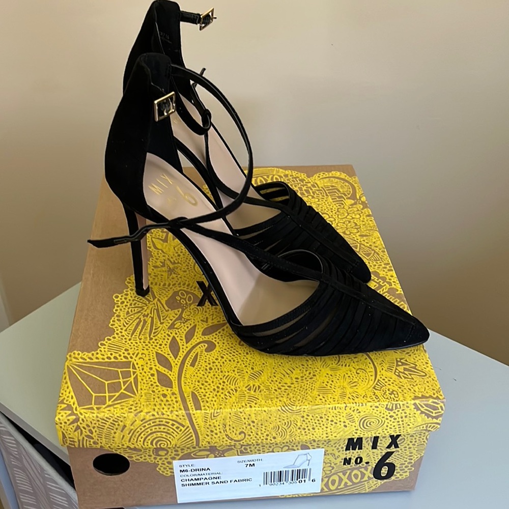 Size 7M. All black heels with mesh and suede on toes. Approx. 4 inch heel.